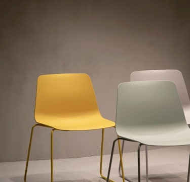 two white chairs and a yellow chair image